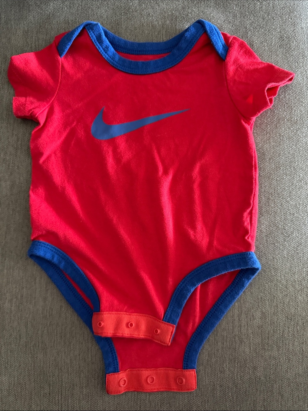 Nike Red Baby Bodysuit with Blue Trim and Swoosh